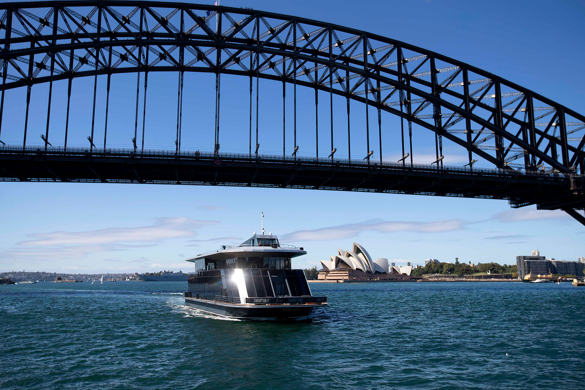 Starship Sydney Cruising Under Harbour Bridge